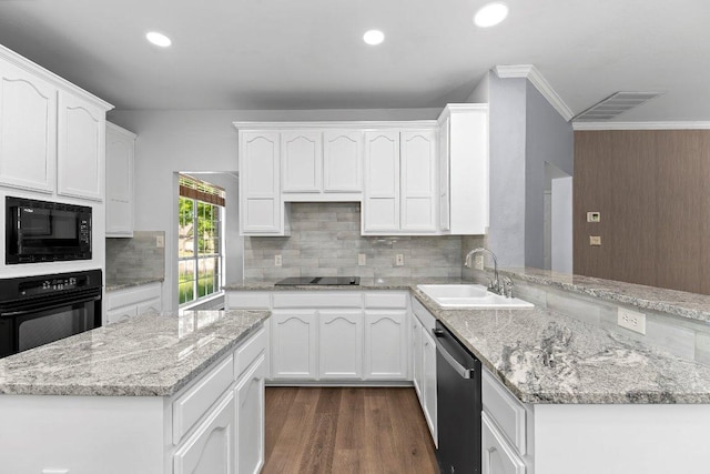 1809 Johnson Way, Round Rock, TX 78681 - kitchen with a sink, white cabinets, visible vents, black appliances, and ornamental molding