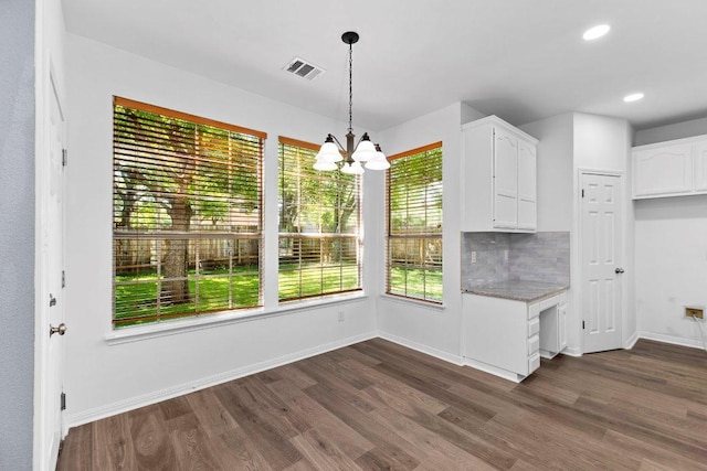 1809 Johnson Way, Round Rock, TX 78681 - unfurnished dining area with an inviting chandelier, visible vents, baseboards, dark wood-style floors, and recessed lighting