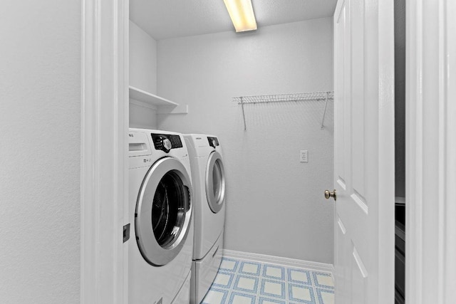1809 Johnson Way, Round Rock, TX 78681 - laundry area with baseboards, light floors, separate washer and dryer, and laundry area