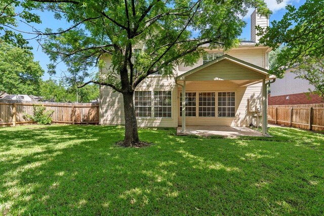 1809 Johnson Way, Round Rock, TX 78681 - back of property with a yard, a patio area, and a fenced backyard