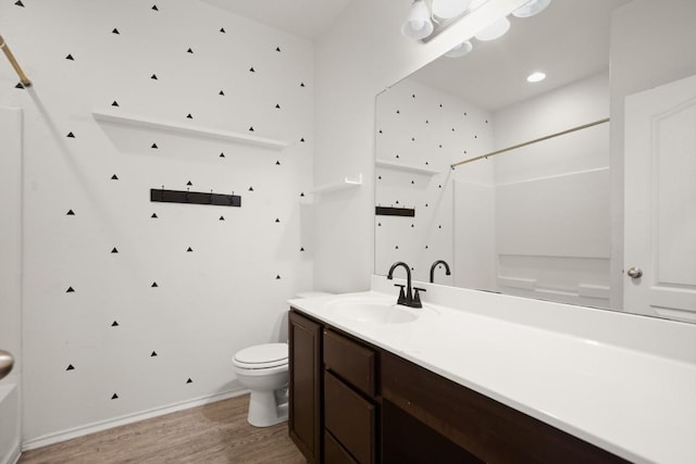 243 Mancos Dr, Georgetown, TX 78626 - bathroom with vanity, a shower, wood finished floors, toilet, and a bathing tub