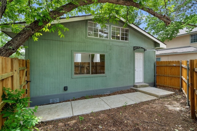 exterior space with crawl space and fence