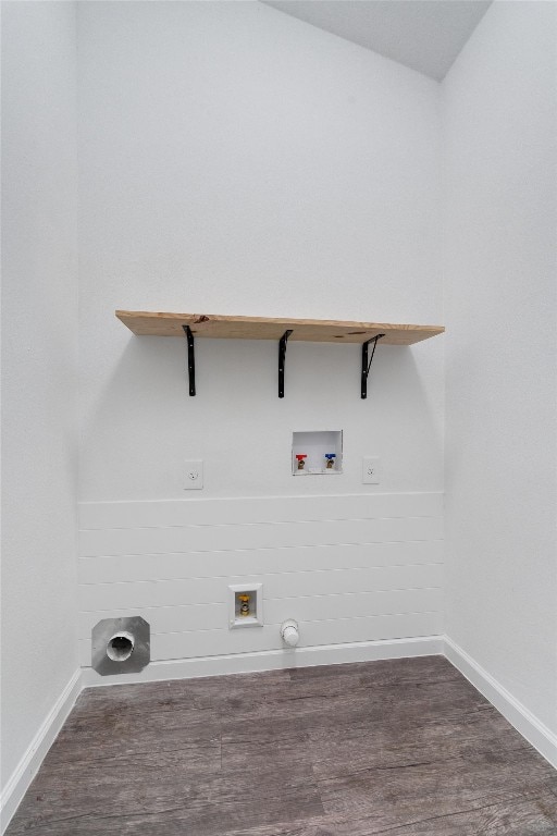 clothes washing area with wood finished floors, laundry area, baseboards, and hookup for a washing machine