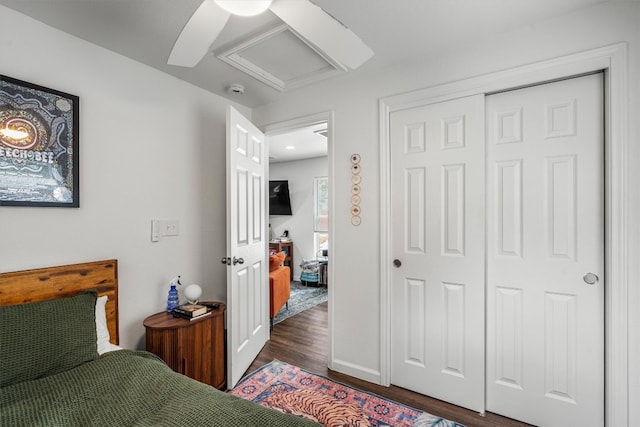 500 Capitol Dr Unit 1, Austin, TX 78753 - bedroom featuring a closet, wood finished floors, attic access, a ceiling fan, and baseboards
