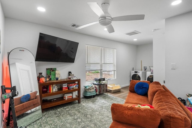 500 Capitol Dr Unit 1, Austin, TX 78753 - living room with washing machine and clothes dryer, recessed lighting, visible vents, and wood finished floors