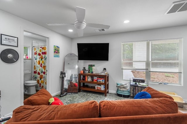 500 Capitol Dr Unit 1, Austin, TX 78753 - carpeted living room featuring baseboards, ceiling fan, and visible vents