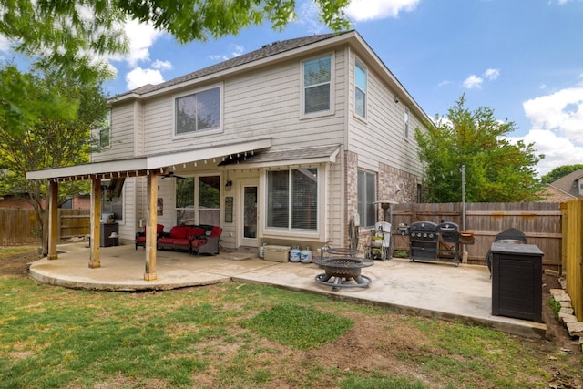 376 Sweet Gum Dr, Kyle, TX 78640 - rear view of property with a patio area and an outdoor living space with a fire pit