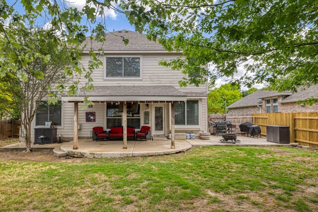 376 Sweet Gum Dr, Kyle, TX 78640 - back of property featuring a patio area, an outdoor living space with a fire pit, and a shingled roof