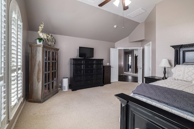 376 Sweet Gum Dr, Kyle, TX 78640 - bedroom featuring vaulted ceiling, multiple windows, carpet flooring, and ceiling fan