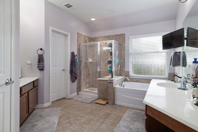 376 Sweet Gum Dr, Kyle, TX 78640 - bathroom with vanity, a garden tub, a stall shower, tile patterned flooring, and lofted ceiling