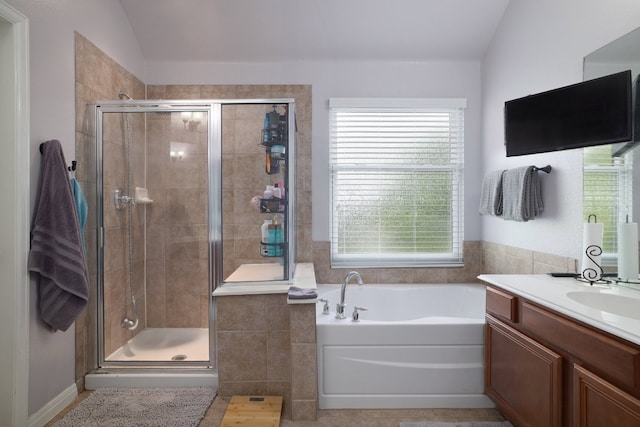 376 Sweet Gum Dr, Kyle, TX 78640 - full bathroom with a bath, vanity, a shower stall, and lofted ceiling