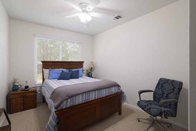 376 Sweet Gum Dr, Kyle, TX 78640 - carpeted bedroom with baseboards and a ceiling fan