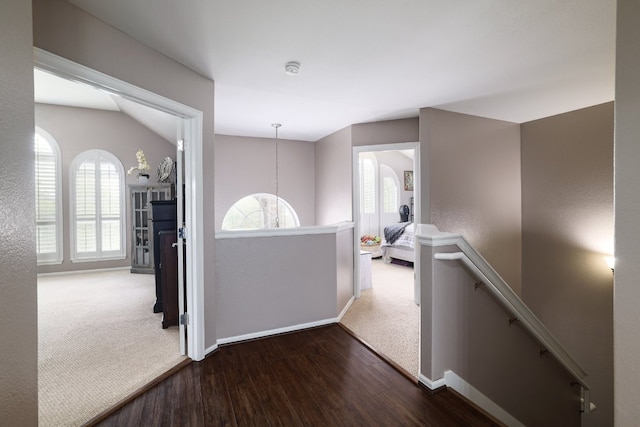 376 Sweet Gum Dr, Kyle, TX 78640 - hallway featuring an upstairs landing, wood finished floors, baseboards, and carpet floors