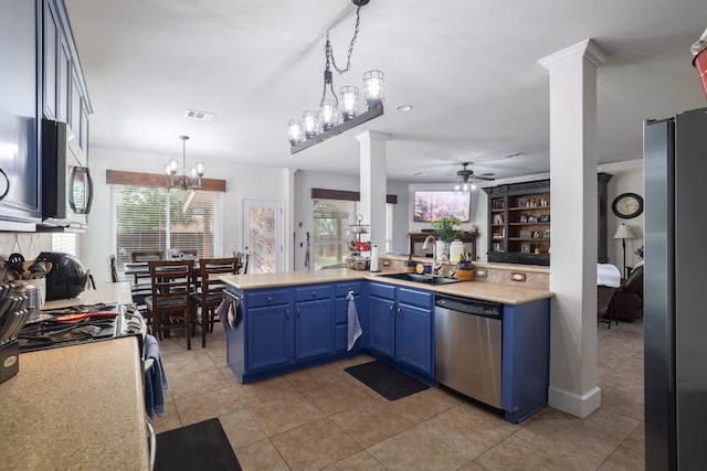 376 Sweet Gum Dr, Kyle, TX 78640 - kitchen with appliances with stainless steel finishes, a sink, blue cabinetry, ornate columns, and a ceiling fan