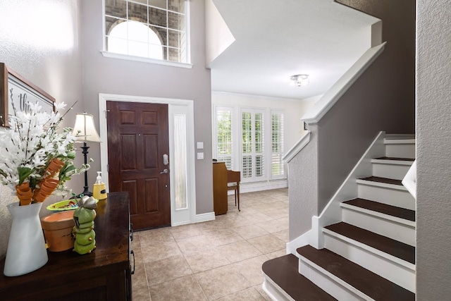 376 Sweet Gum Dr, Kyle, TX 78640 - tiled entrance foyer featuring stairway