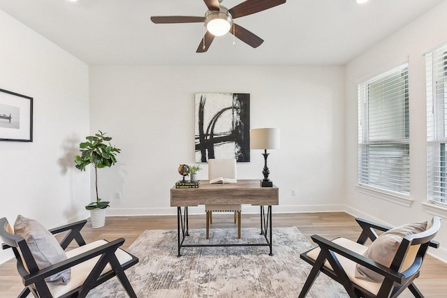 home office featuring light wood-style floors, a ceiling fan, baseboards, and recessed lighting