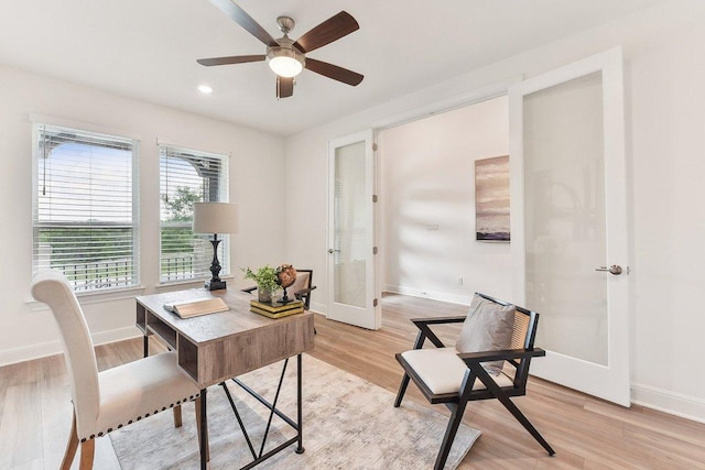 home office featuring a ceiling fan, french doors, baseboards, light wood-style floors, and recessed lighting