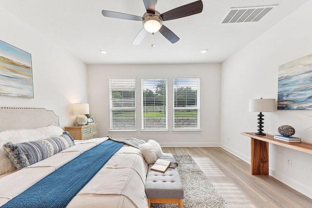 bedroom with visible vents, baseboards, recessed lighting, a ceiling fan, and light wood finished floors