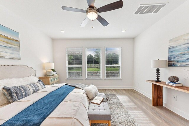 377 Running Bird Rd, Austin, TX 78737 - bedroom with light wood-style floors, baseboards, ceiling fan, and recessed lighting