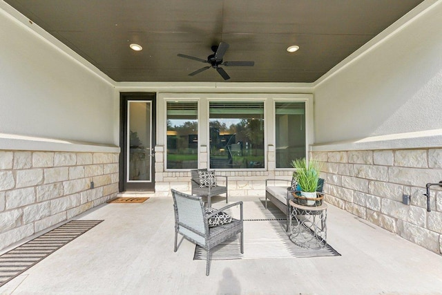 view of patio / terrace with a ceiling fan and an outdoor living space