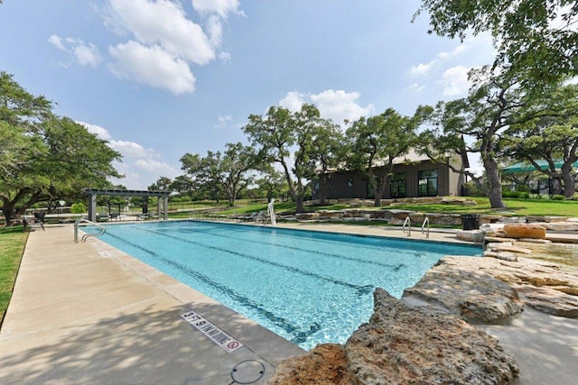 community pool with a pergola