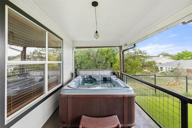 exterior space featuring a lawn and a hot tub