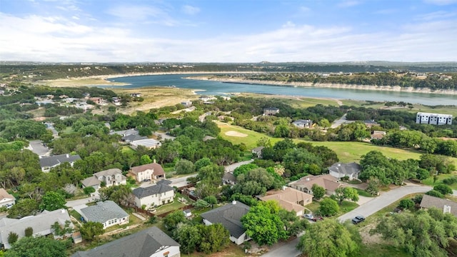 birds eye view of property with a water view and a residential view