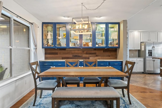 dining space with light wood-type flooring