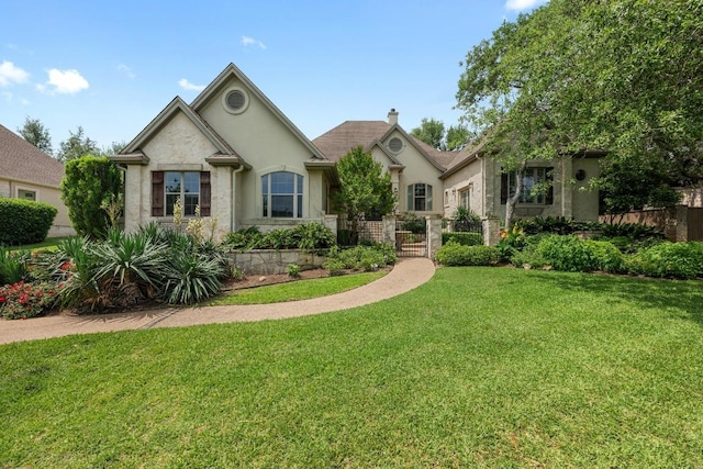 ranch-style house featuring fence, a chimney, a front lawn, and stucco siding