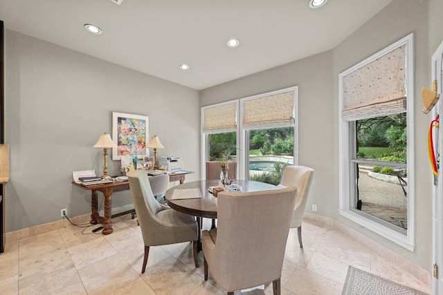 dining area featuring recessed lighting and baseboards