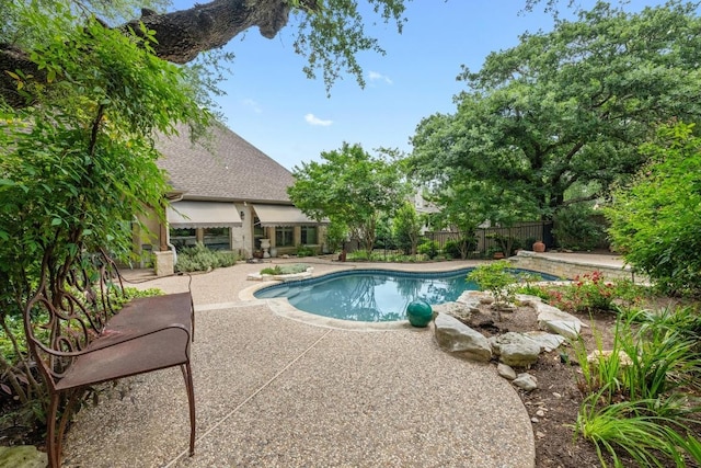 view of pool with fence, a fenced in pool, and a patio area