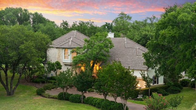 109 Lost Spur, Horseshoe Bay, TX 78657 - exterior space featuring a chimney and a front yard