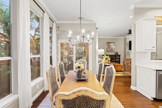 109 Lost Spur, Horseshoe Bay, TX 78657 - dining area featuring dark wood-style flooring, crown molding, a chandelier, and ceiling fan