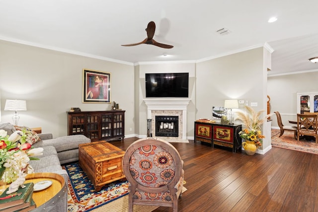 109 Lost Spur, Horseshoe Bay, TX 78657 - living room featuring ceiling fan, ornamental molding, and dark wood-style flooring