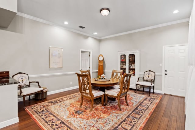 109 Lost Spur, Horseshoe Bay, TX 78657 - dining area featuring dark wood-style floors, recessed lighting, ornamental molding, and baseboards
