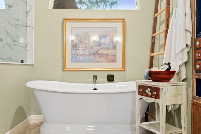 109 Lost Spur, Horseshoe Bay, TX 78657 - bathroom featuring a freestanding bath and baseboards