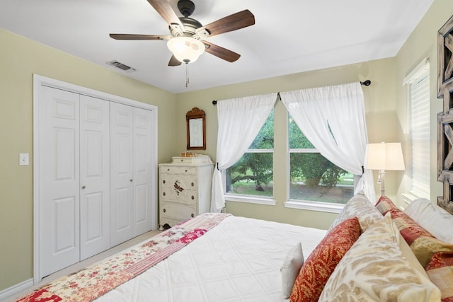109 Lost Spur, Horseshoe Bay, TX 78657 - bedroom with baseboards, a ceiling fan, a closet, and visible vents
