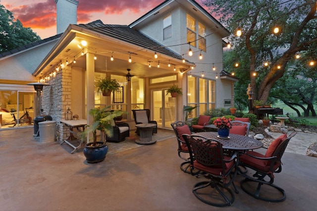 109 Lost Spur, Horseshoe Bay, TX 78657 - patio terrace at dusk featuring outdoor dining space