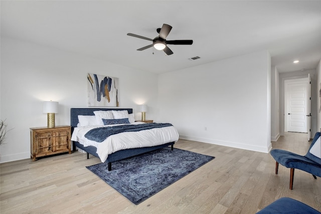 bedroom featuring ceiling fan, light wood finished floors, recessed lighting, baseboards, and visible vents