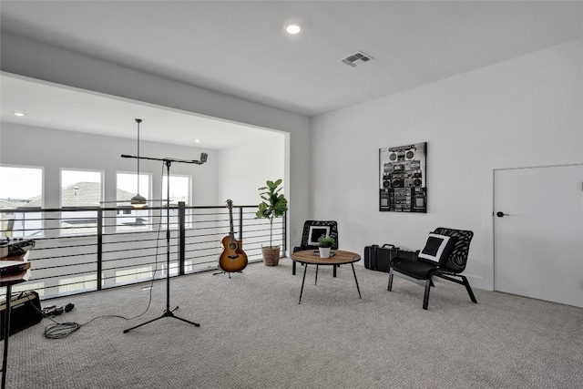 sitting room featuring visible vents, carpet flooring, and recessed lighting