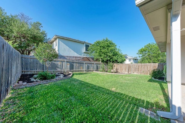 view of yard featuring a fenced backyard