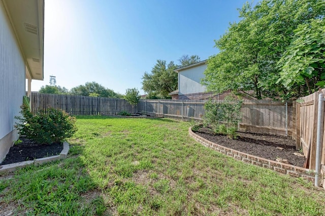 view of yard with a fenced backyard
