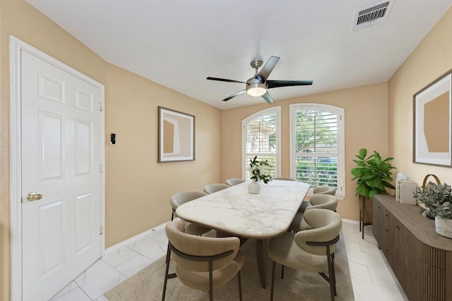 dining area featuring visible vents, baseboards, and ceiling fan