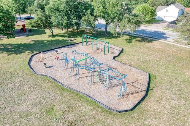 surrounding community featuring playground community and a yard