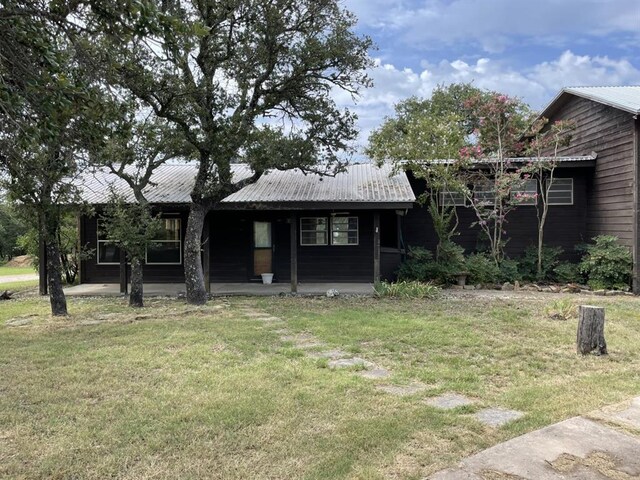 401 County Road 128, Burnet, TX 78611 - exterior space with a lawn, metal roof, and a porch
