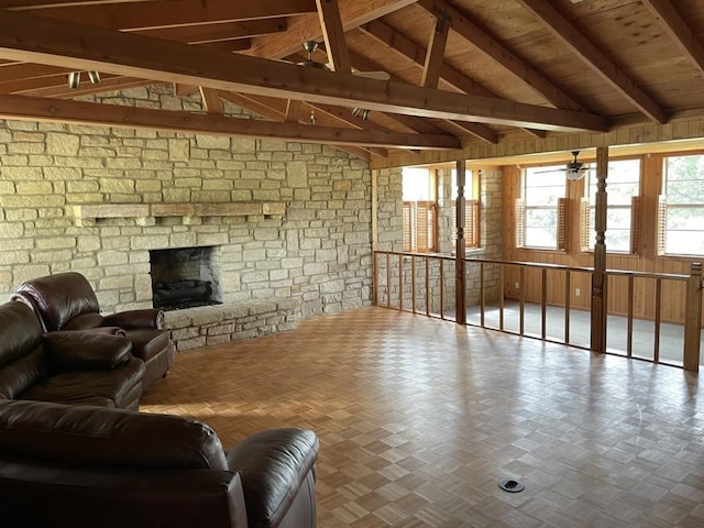 401 County Road 128, Burnet, TX 78611 - living room featuring wooden walls, wood ceiling, a stone fireplace, and vaulted ceiling with beams