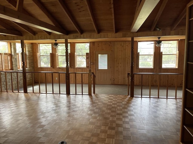 401 County Road 128, Burnet, TX 78611 - misc room featuring ceiling fan, lofted ceiling with beams, wood walls, and a wealth of natural light