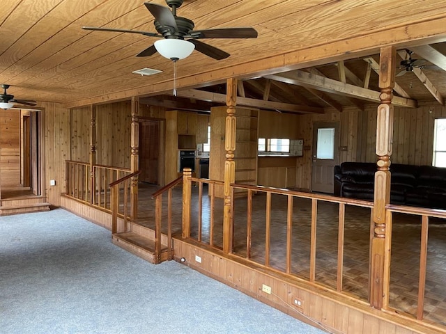 401 County Road 128, Burnet, TX 78611 - basement featuring carpet floors, a ceiling fan, wood ceiling, and wooden walls