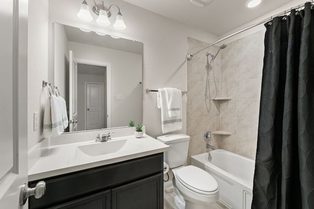 bathroom featuring toilet, shower / bath combination with curtain, and vanity