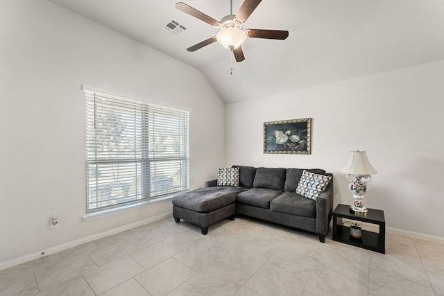 living room with ceiling fan, baseboards, light tile patterned floors, vaulted ceiling, and visible vents